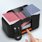 Electric card shuffler in action, shuffling a red and blue deck of playing cards