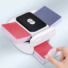 Electric card shuffler in action, shuffling a red and blue deck of playing cards