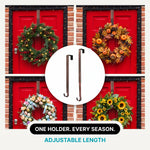 Artificial fall wreath with a measurement line showing a 22-inch diameter when fully extended