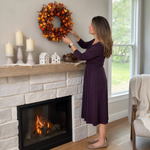 Artificial fall wreath with a measurement line showing a 22-inch diameter when fully extended