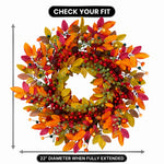 Artificial fall wreath with a measurement line showing a 22-inch diameter when fully extended