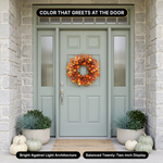 Artificial fall wreath displayed on a front door, porch and above a fireplace