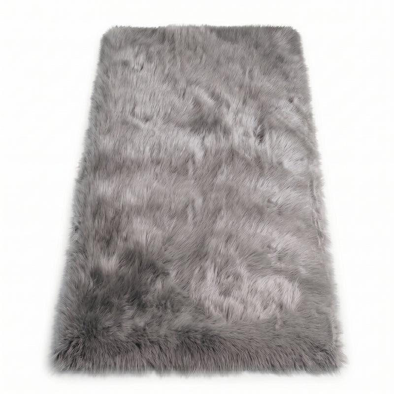 Close-up of grey faux fur area rug showing thick high-pile shaggy texture