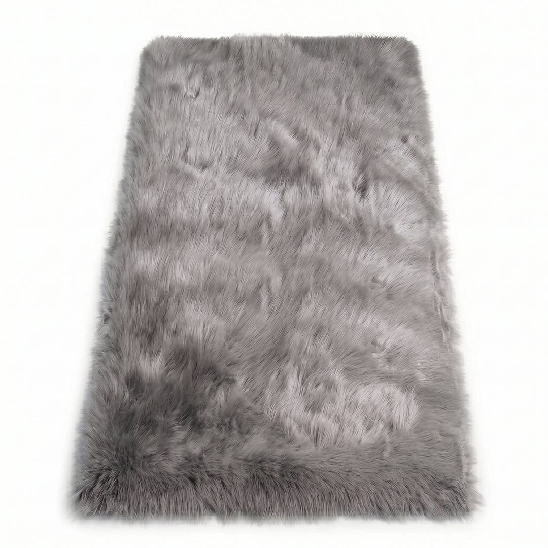 Close-up of grey faux fur area rug showing thick high-pile shaggy texture