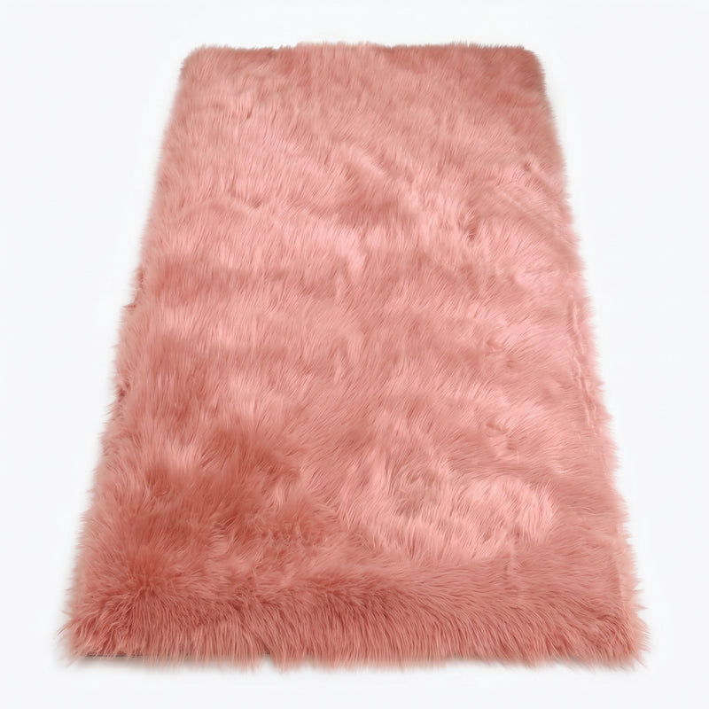 Close-up of grey faux fur area rug showing thick high-pile shaggy texture
