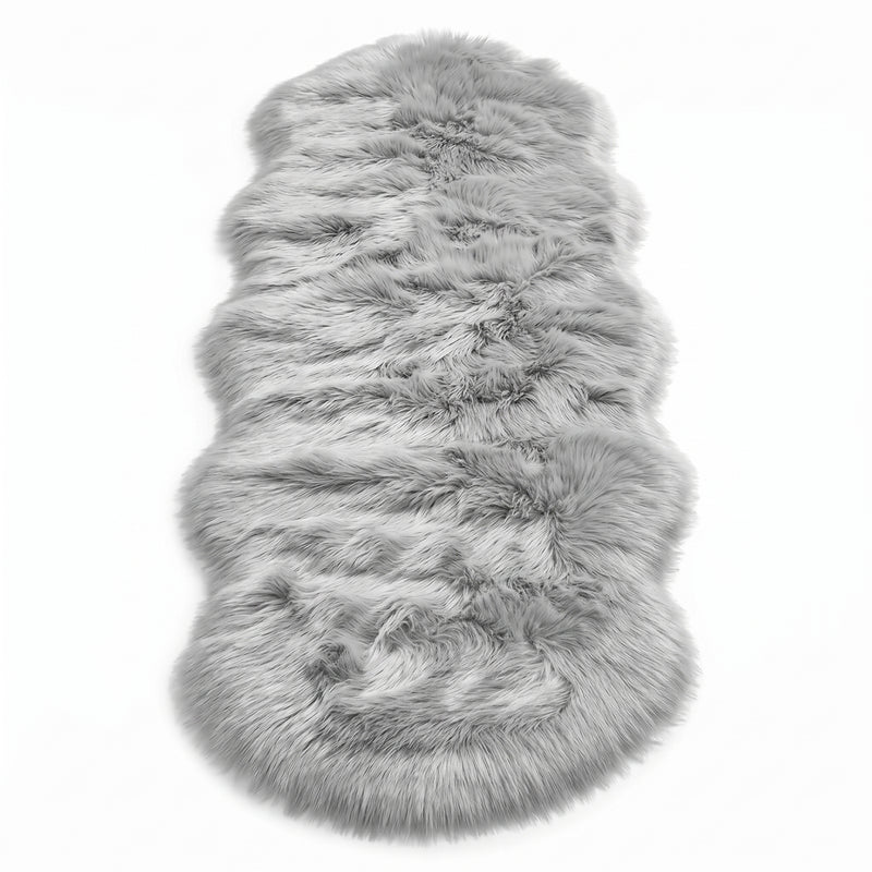 Close-up of grey faux fur area rug showing thick high-pile shaggy texture