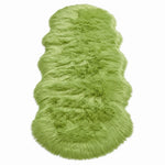 Close-up of grey faux fur area rug showing thick high-pile shaggy texture