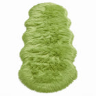 Close-up of grey faux fur area rug showing thick high-pile shaggy texture