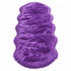 Close-up of grey faux fur area rug showing thick high-pile shaggy texture