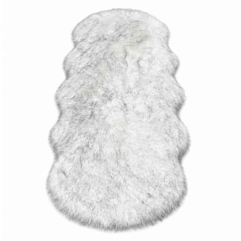 Close-up of grey faux fur area rug showing thick high-pile shaggy texture