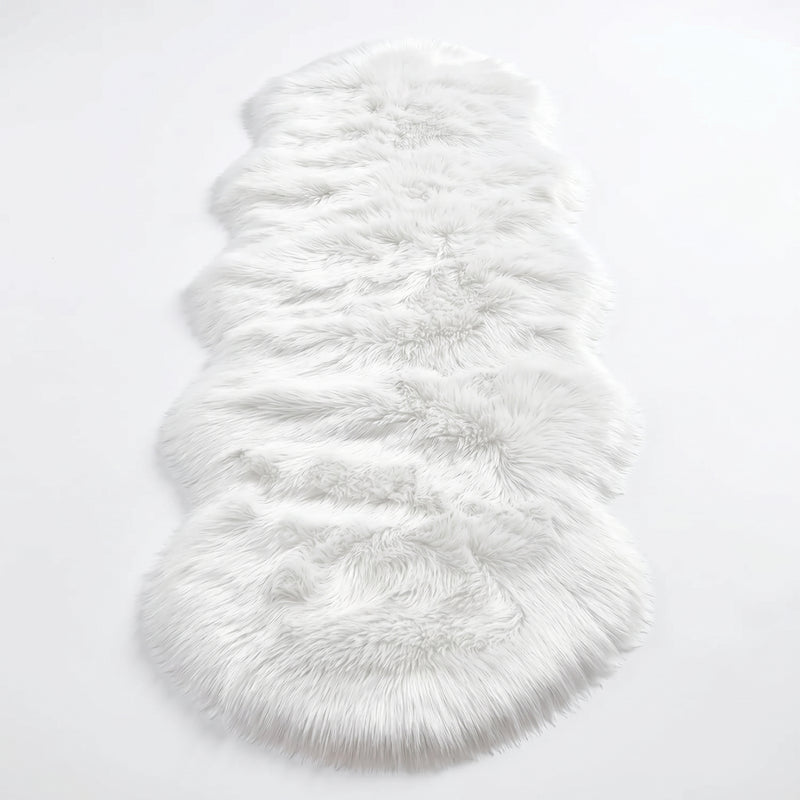 Close-up of grey faux fur area rug showing thick high-pile shaggy texture