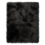 Close-up of grey faux fur area rug showing thick high-pile shaggy texture
