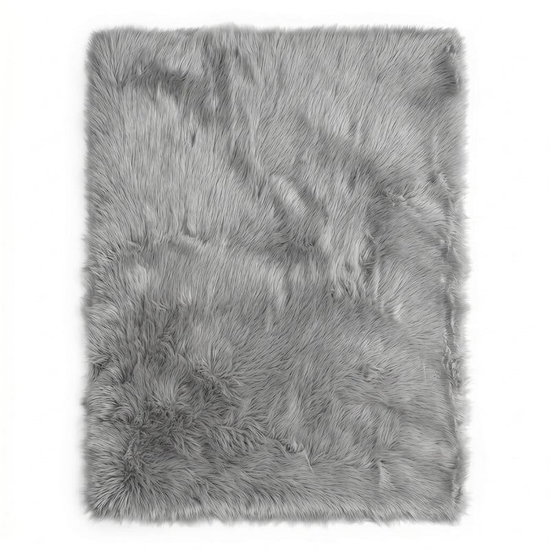 Close-up of grey faux fur area rug showing thick high-pile shaggy texture