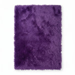 Close-up of grey faux fur area rug showing thick high-pile shaggy texture