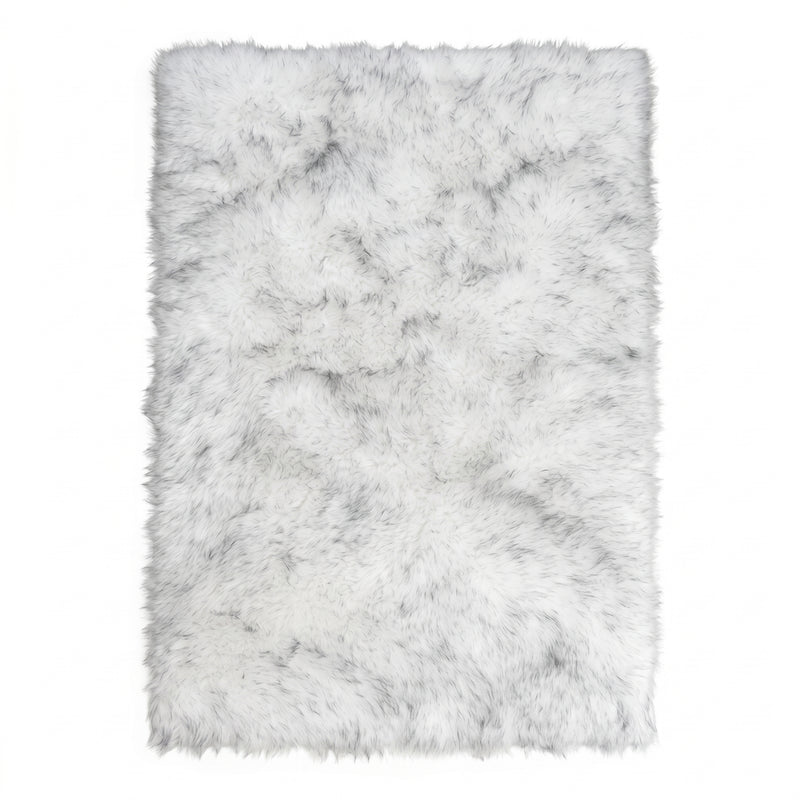 Close-up of grey faux fur area rug showing thick high-pile shaggy texture