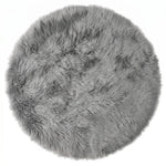 Close-up of grey faux fur area rug showing thick high-pile shaggy texture