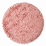 Close-up of grey faux fur area rug showing thick high-pile shaggy texture