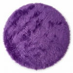 Close-up of grey faux fur area rug showing thick high-pile shaggy texture