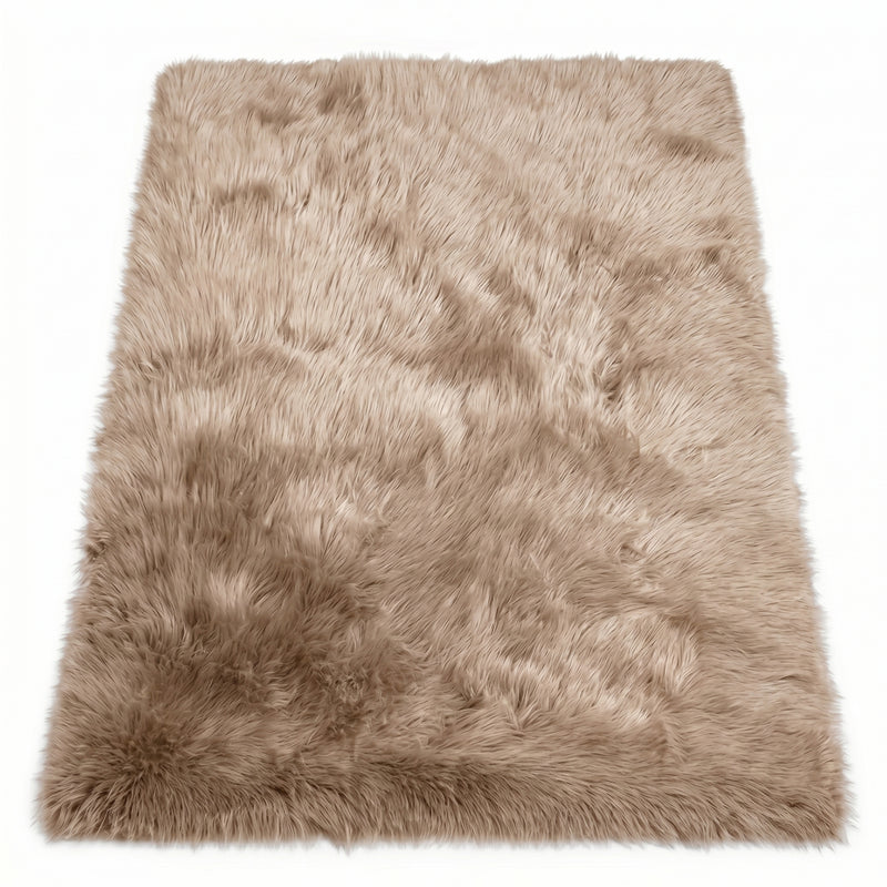 Close-up of grey faux fur area rug showing thick high-pile shaggy texture
