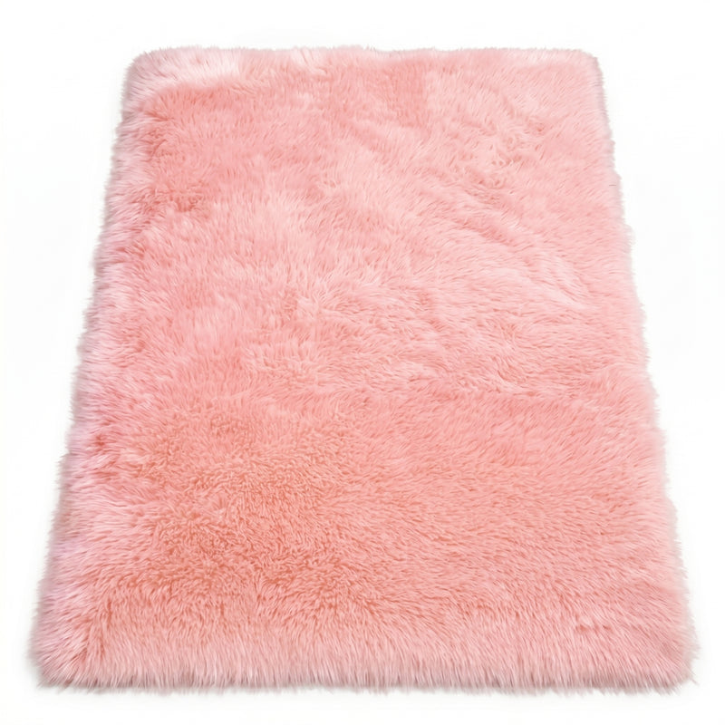 Close-up of grey faux fur area rug showing thick high-pile shaggy texture