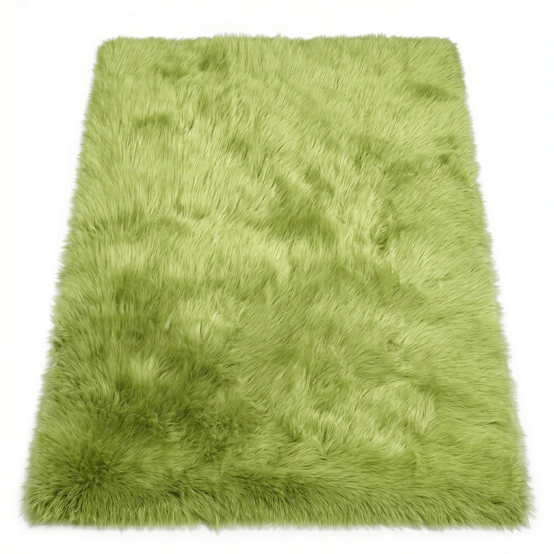 Close-up of grey faux fur area rug showing thick high-pile shaggy texture
