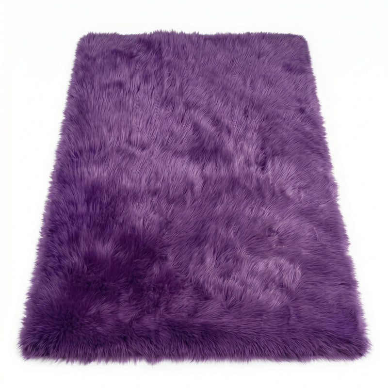 Close-up of grey faux fur area rug showing thick high-pile shaggy texture