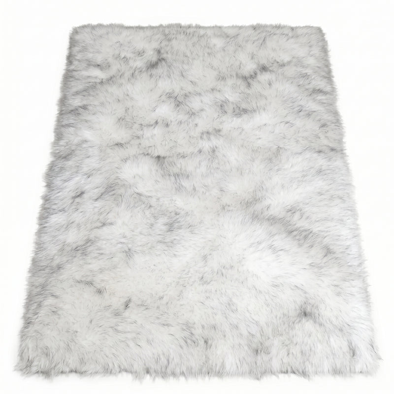 Close-up of grey faux fur area rug showing thick high-pile shaggy texture