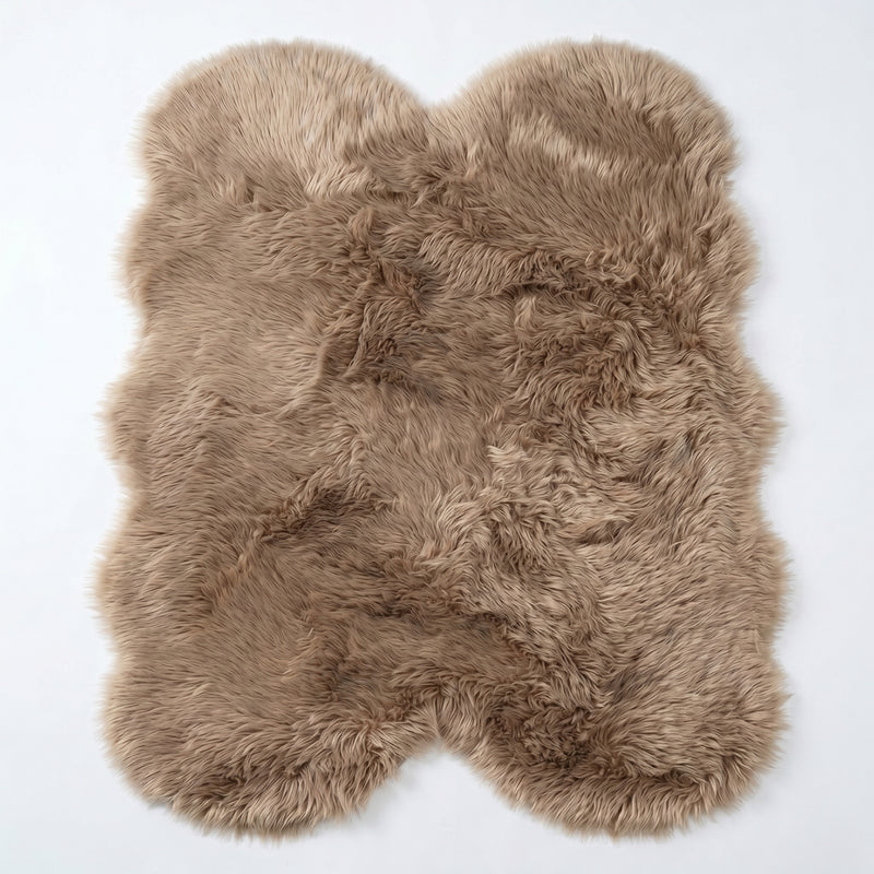 Close-up of grey faux fur area rug showing thick high-pile shaggy texture