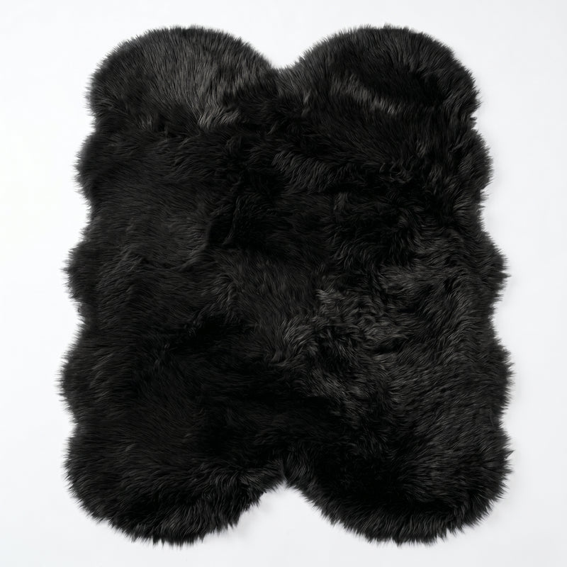 Close-up of grey faux fur area rug showing thick high-pile shaggy texture