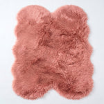 Close-up of grey faux fur area rug showing thick high-pile shaggy texture
