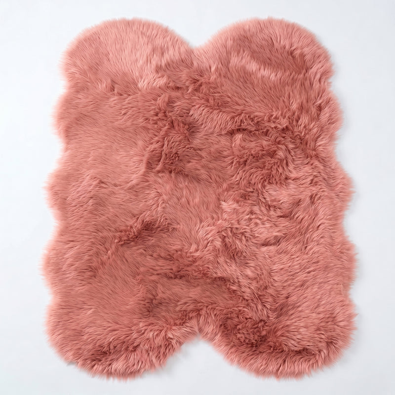 Close-up of grey faux fur area rug showing thick high-pile shaggy texture