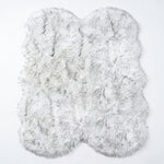 Close-up of grey faux fur area rug showing thick high-pile shaggy texture