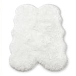 Close-up of grey faux fur area rug showing thick high-pile shaggy texture