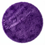 Close-up of grey faux fur area rug showing thick high-pile shaggy texture