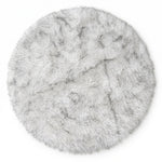Close-up of grey faux fur area rug showing thick high-pile shaggy texture