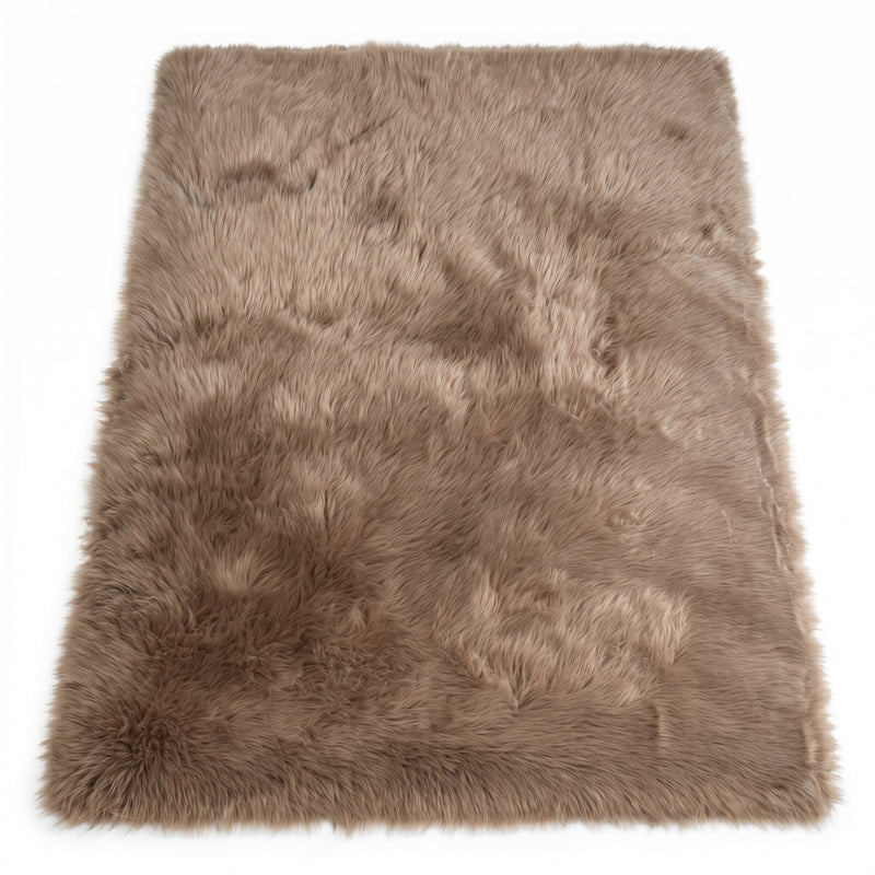 Close-up of grey faux fur area rug showing thick high-pile shaggy texture