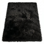 Close-up of grey faux fur area rug showing thick high-pile shaggy texture