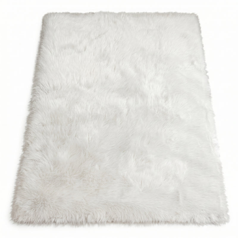 Close-up of grey faux fur area rug showing thick high-pile shaggy texture