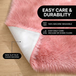 Faux fur area rug shown beside a bed, illustrating machine-washable, vacuum-or-shake-clean maintenance