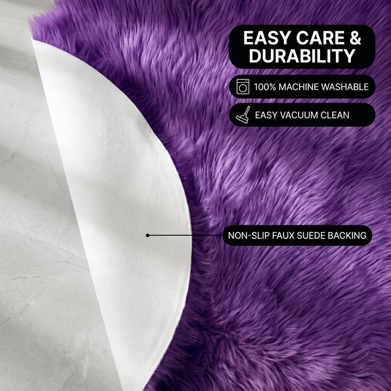 Faux fur area rug shown beside a bed, illustrating machine-washable, vacuum-or-shake-clean maintenance