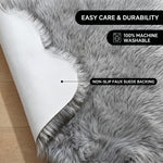 Faux fur area rug shown beside a bed, illustrating machine-washable, vacuum-or-shake-clean maintenance