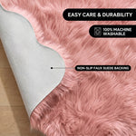 Faux fur area rug shown beside a bed, illustrating machine-washable, vacuum-or-shake-clean maintenance