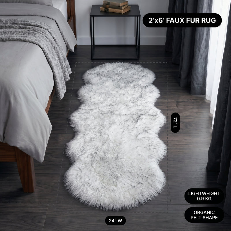 Faux fur area rug with a coffee mug on top, highlighting the 2.36-inch ultra-plush pile and lightweight design