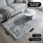 Faux fur area rug with a coffee mug on top, highlighting the 2.36-inch ultra-plush pile and lightweight design