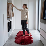 Faux fur sheepskin rug on a closet floor with a woman standing barefoot while reaching for a hanger