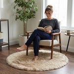 Faux fur sheepskin rug on a closet floor with a woman standing barefoot while reaching for a hanger