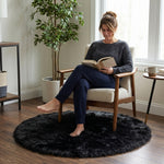 Faux fur sheepskin rug on a closet floor with a woman standing barefoot while reaching for a hanger