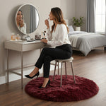 Faux fur sheepskin rug on a closet floor with a woman standing barefoot while reaching for a hanger