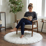Faux fur sheepskin rug on a closet floor with a woman standing barefoot while reaching for a hanger