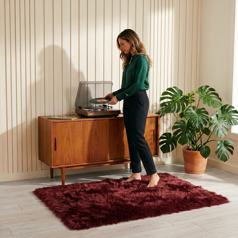 Faux fur sheepskin rug on a closet floor with a woman standing barefoot while reaching for a hanger